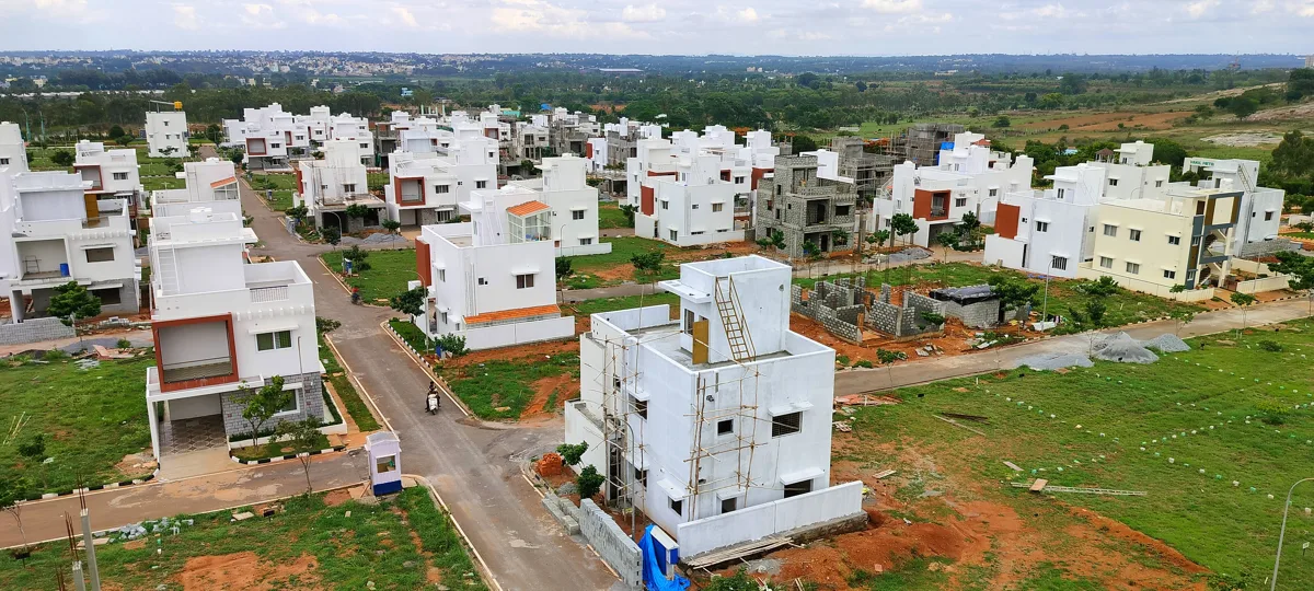 Drone photograph showing actual villas, internal roads and ongoing development